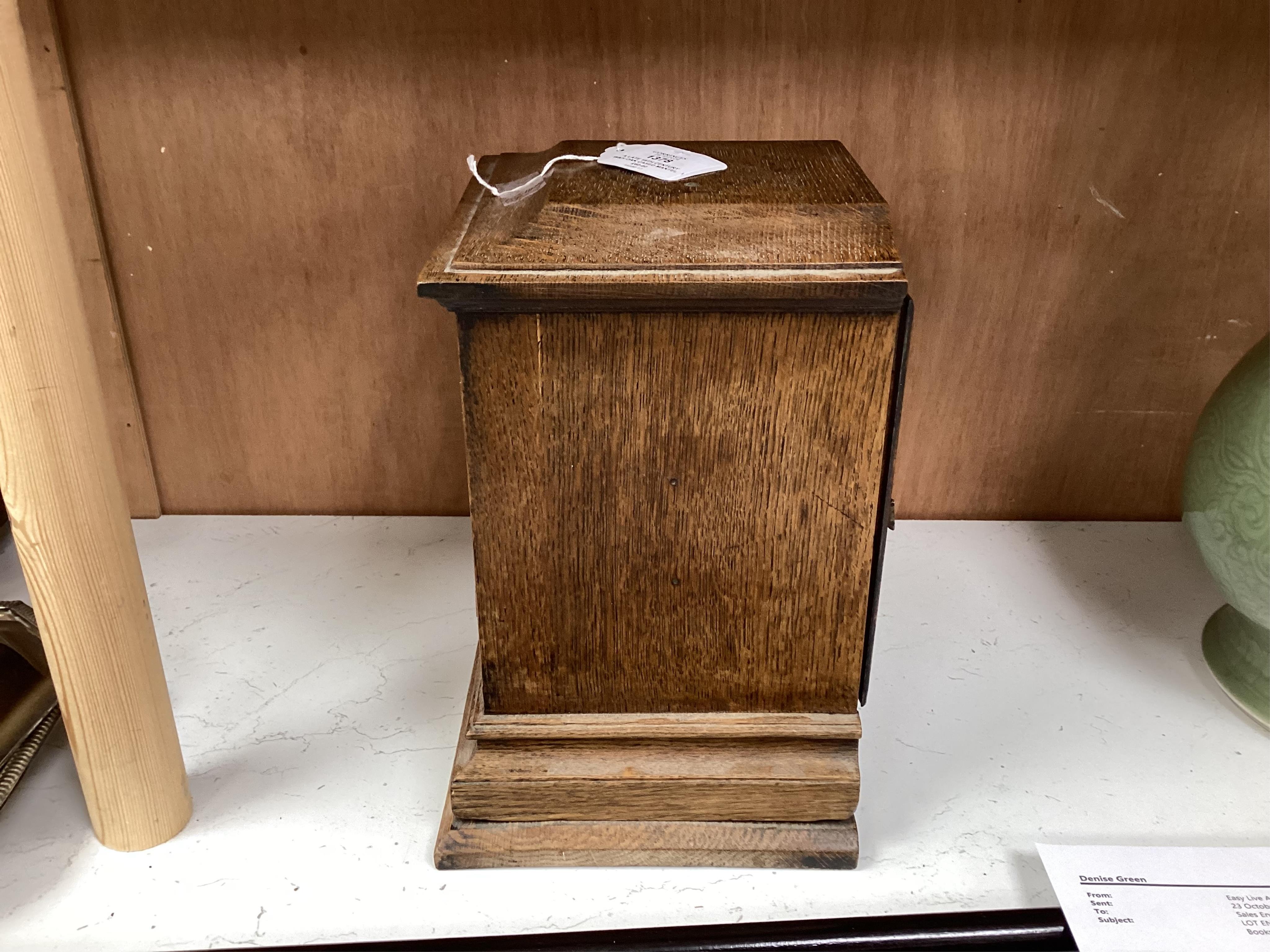 A late 19th century W&H oak cased mantel clock, chiming and striking on two coiled gongs, 27cm high. Condition - fair to good, missing the handle to the top